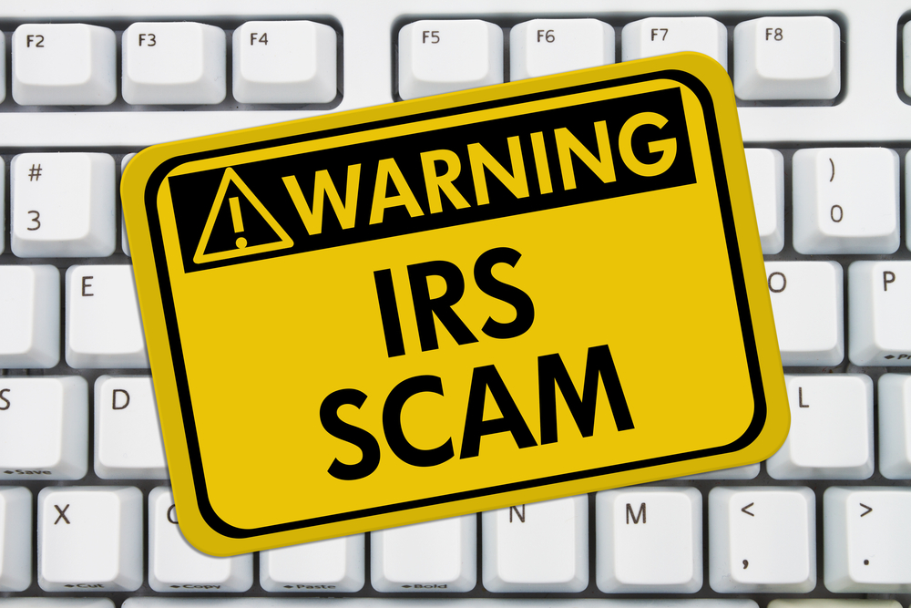 IRS scam warning sign on white keyboard