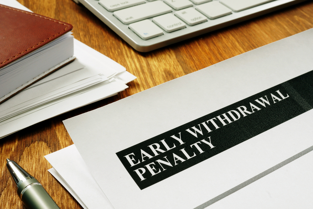 Early withdrawal penalty form on desk with keyboard and pen