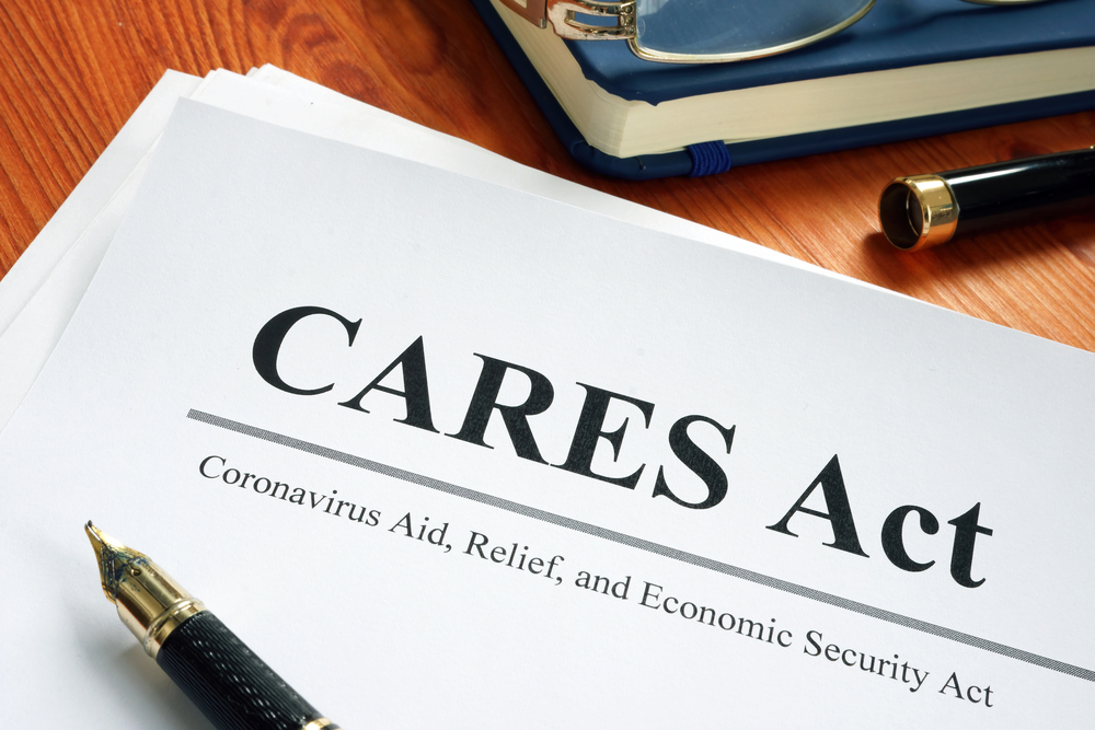 CARES Act document on desk with pen