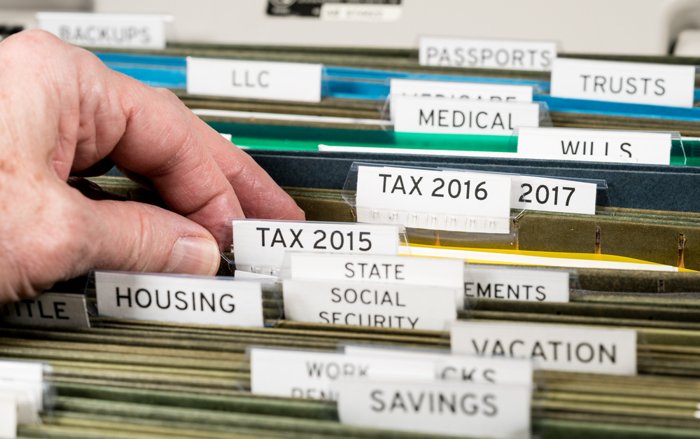 Tax documents organized in hanging folders