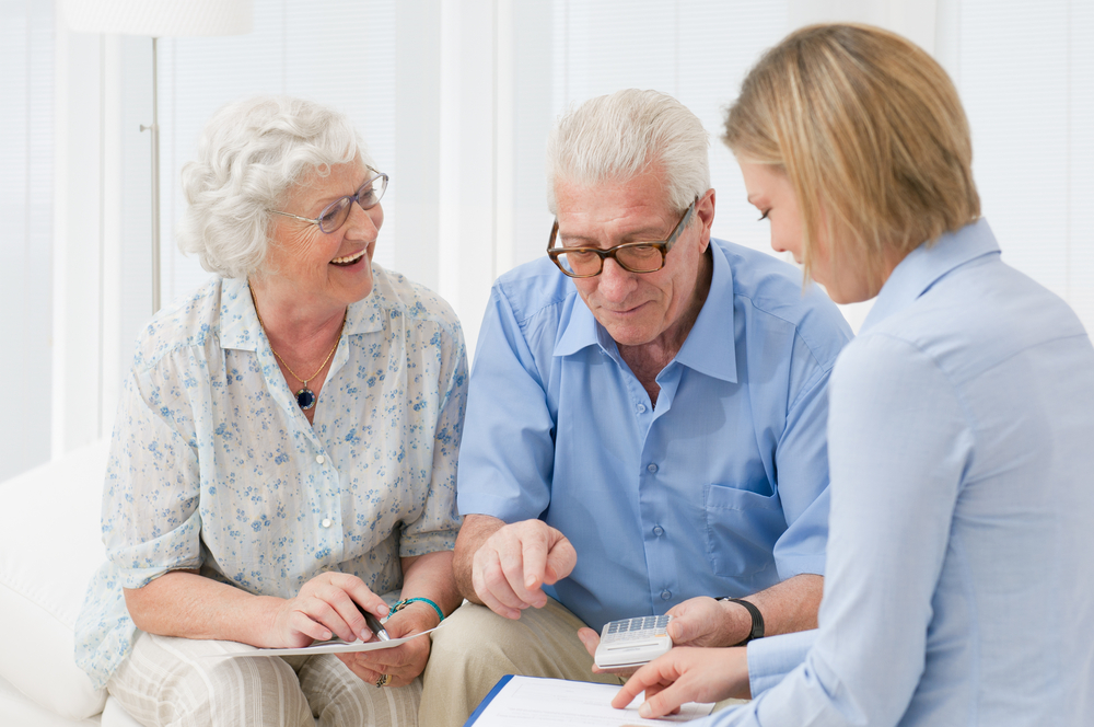 Senior couple reviewing finances with accountant