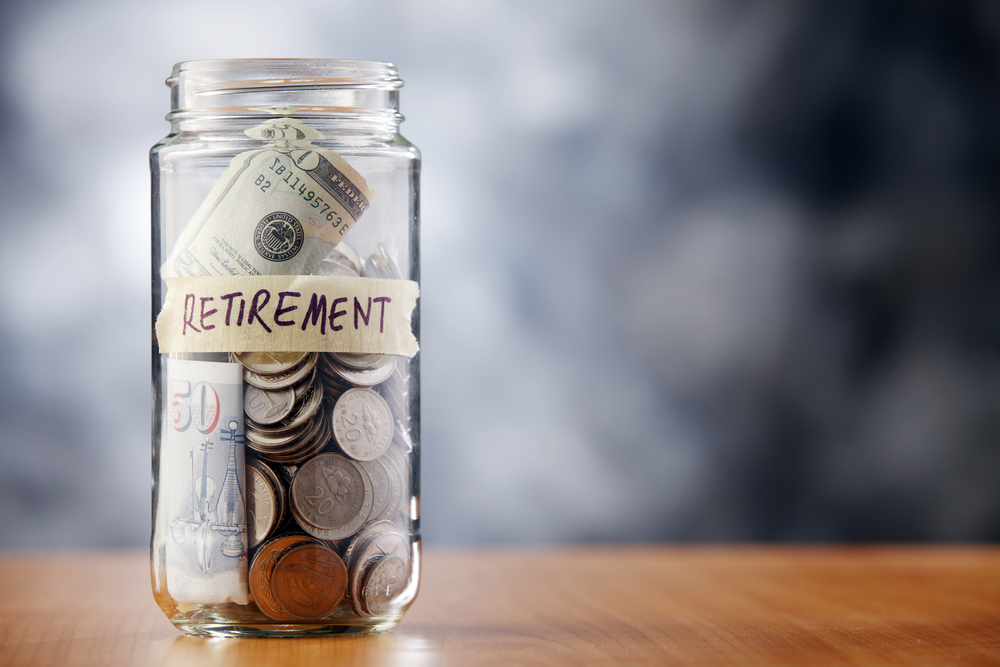 Jar with coins and bills marked Retirement